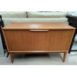 A modern mahogany small chest of 3 drawers; a 1960's teak record cabinet