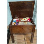 An early 20th century oak workbox/stool and contents