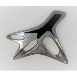 Georg Jensen: a modernist silver brooch designed by Henning Koppel, with black enamel decoration,
