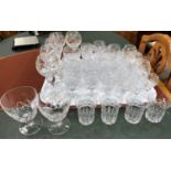 A part suite of 28 cut crystal drinking glasses of various sizes including hock, brandy, sherry, and