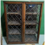 An oak leaded glass display cabinet with three shelves, ht 128cm length 99cm ( top and base need