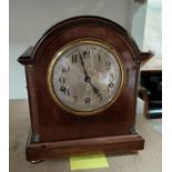 A mahogany cased mantel clock