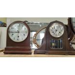 Two oak cased mantel clocks, both with keys and pendula, one chiming, one striking
