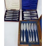 Two boxed sets of silver handle tea knives; a 19th century fish canteen in fitted mahogany box