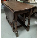 A 1930's oak gate leg table