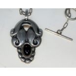 Georg Jensen: a silver pendant designed by Henning Koppel, set cabochon amethyst on silver link