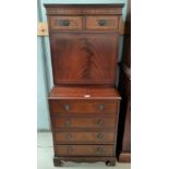 A mahogany reproduction Secretaire with pull down writing slope, fitted interior, 4 long and two