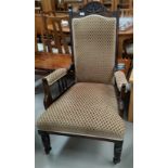 An Edwardian armchair in gold patterned upholstery
