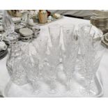 A Waterford crystal decanter; a selection of Tyrone crystal champagne and other glasses.
