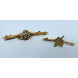 An Edwardian seed pearl set bar brooch, stamped '9ct'; a maple leaf bar brooch, stamped '10K, 3.4 gm