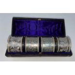 A hallmarked silver set of 4 napkin rings, cased, London 1876, 2.8 oz