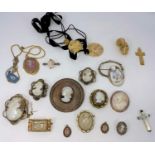 A selection of shell cameo brooches, Wedgwood pendants, other carved brooches etc