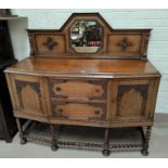 A heavy golden oak Sideboard on barley twist legs with double drawers & double doors; raised back