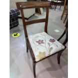 A set of 7 (6 + 1) Regency style mahogany dining chairs with seats upholstered in cream and floral