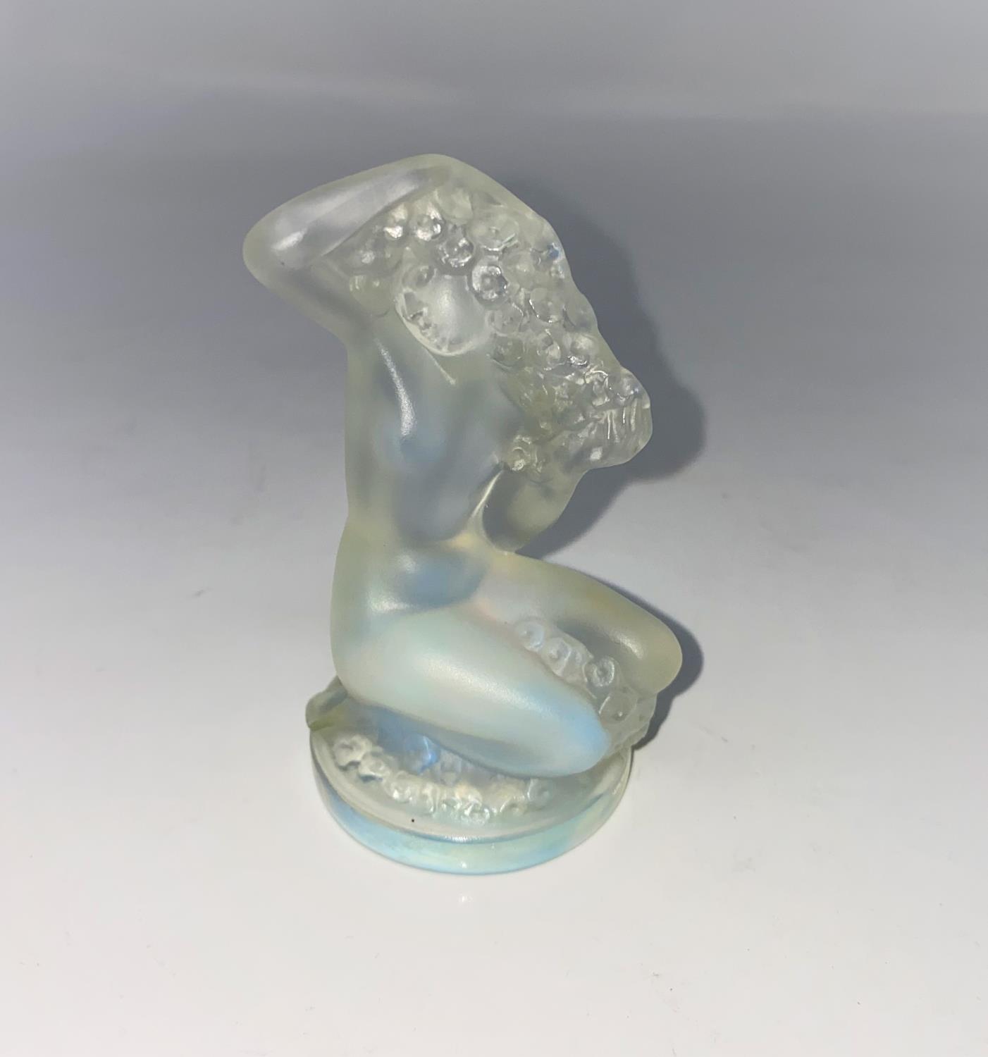 A Lalique mascot depicting a kneeling flower girl (female figure) 'Floreal' signed in script and