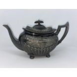 A 19th century EPBM teapot with chased floral decoration and reeded lower body