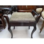 An Edwardian stained walnut piano stool with box seat