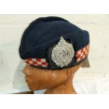 A Scottish Glengarry with Argyll and Sutherland Highlanders badge, a similar hat; an RAF belt and