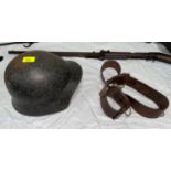 A GERMAN inter-wars period M18 steel helmet with original leather liner; a British Officer's WWI