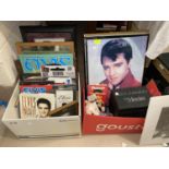 A collection of Elvis Presley souvenirs including pictures, video etc