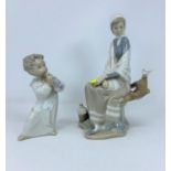 2 Lladro groups - seated girl with bird; boy with flute 25 & 26cm