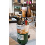 A vintage Castrol Oil automatic fluid spray device with trolley; vintage Castrol oil jug & grease