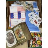 A selection of loose stamps and postcards in alum