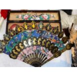 A 19th century Chinese Fan with decorative gilt & black lacquer sticks, the paper panels painted