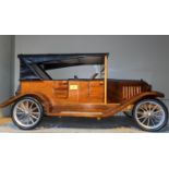 A handmade wooden model of an early 20th century motor car, length 82cm