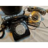 A 1970's black telephone, 1970's telephone in stainless steel