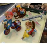 Four vintage tinplate wind up toys from Japan, Korea etc