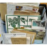 A tin of postcards, first day covers etc