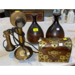 An early 20th century brass stick telephone; a walnut brass mounted dome top box; a pair of baluster