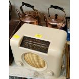 A cream Bakelite Bush mains radio; 2 copper kettles