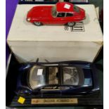 A Franklin Mint 1961 E Type Jaguar coupe original box, packing certificate etc; a Maisto Jaguar
