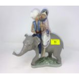 Lladro group of young couple riding elephant height 24cm