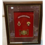 A display case of Grenadier Guards items including buckle etc