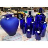 A graduating set of 7 Bristol Blue bottles & a vase
