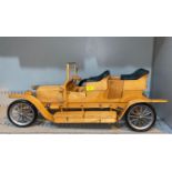 A handmade wooden model of an early 20th century open top motor car, length 84cm