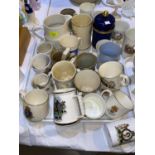 A large selection of commemorative mugs