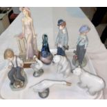 A Lladro clown and 2 Lladro figures of boys; 2 Lladro polar bears; 2 geese and a Royal Doulton glass