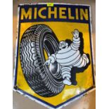A vintage enamel metal advertising sign for Michelin Tyres in shield form height 60cm Width 45cm
