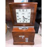 A Blick Time Recorder Ltd clocking in clock with original key height 70cm