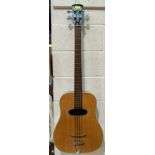 An Eko acoustic bass guitar (some slight body damage)