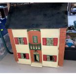 A mid 20th century front opening dolls house