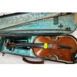 A vintage violin hard case with 2 bows