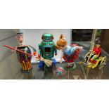 A Vintage Japanese tin plate clockwork robot and three other tin plate toys