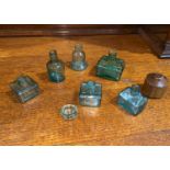 Six vintage glass ink pots of various shapes and a pot inkwell