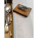 A chrome JAGUAR mascot and a selection of silver plated cutlery