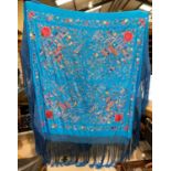 A Chinese silk embroidered shawl 130cm square (excluding fringe) and another